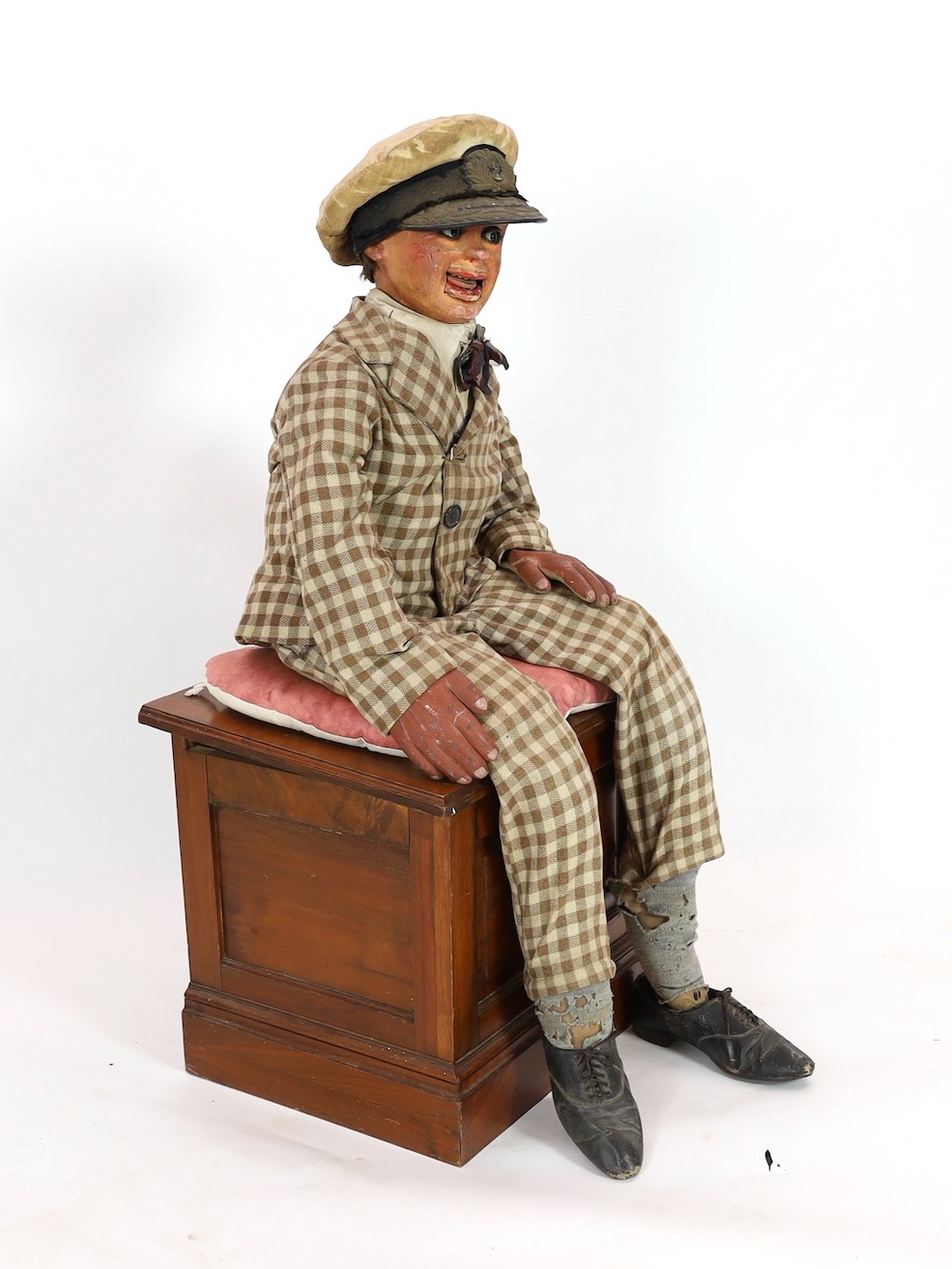 A Leonard Insull ventriloquist's dummy, approx. 130cm high, with walnut box seat